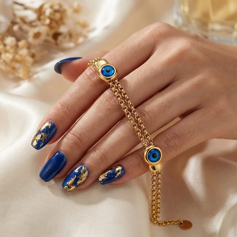 A stylish gold bracelet made of rust-resistant stainless steel, with two interlocking chains and a double "blue eye" design for a modern look, with an adjustable clasp to fit you. - Image 4